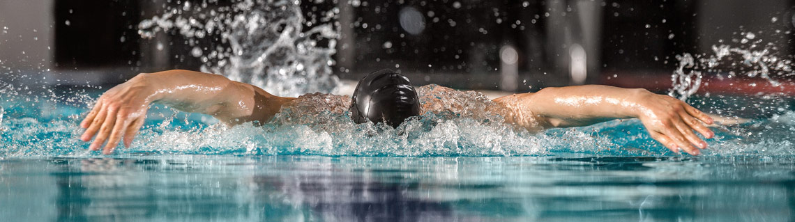 male swimmer swimming butterfly